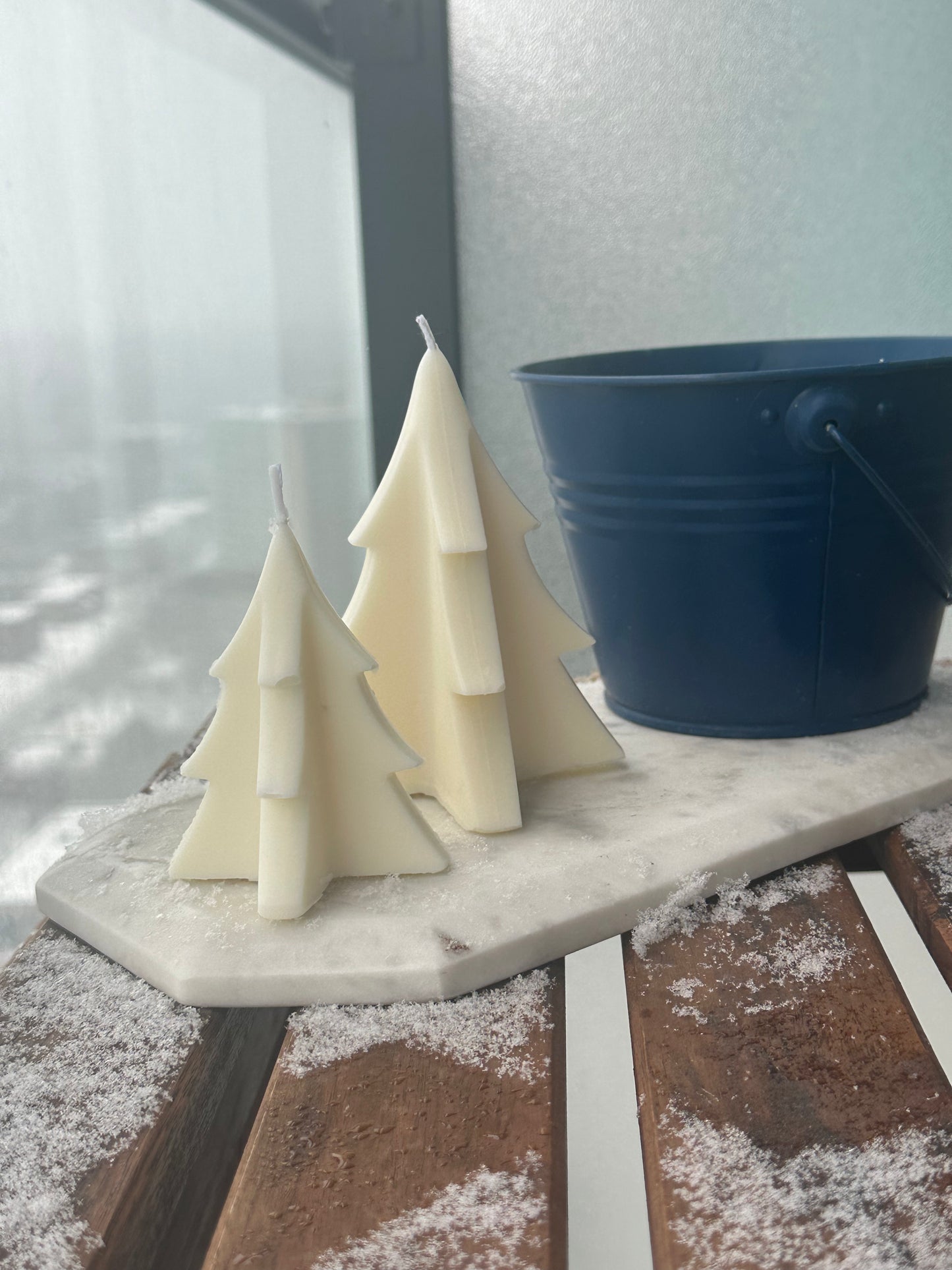 Handmade Christmas tree shaped candle with intricate details.